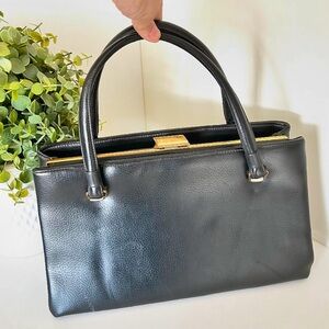 Vintage 60s black leather hand band with gold-tone hardware by National